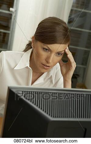 portrait of businesswoman looking at computer screen View Large Photo Image Stock Image - portrait of businesswoman looking at computer screen. Fotosearch