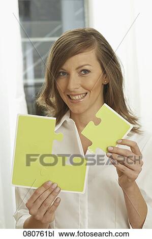 portrait of businesswoman putting jogsaw pieces together View Large Photo Image Stock Image - portrait of businesswoman putting jogsaw pieces together. Fotosearch