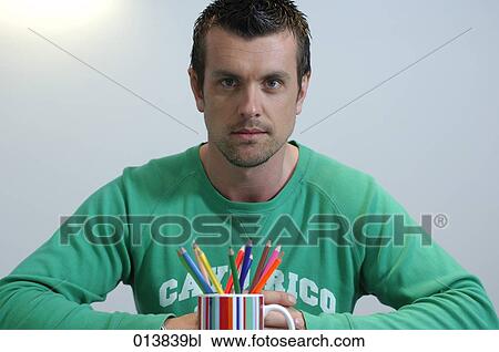 portrait of casually dressed man with mug of pencils View Large Photo Image Stock Image - portrait of casually dressed man with mug of pencils. Fotosearch