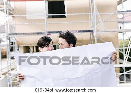 portrait of couple in front their new home with plan View Large Photo Image Stock Image - portrait of couple in front their new home with plan. Fotosearch
