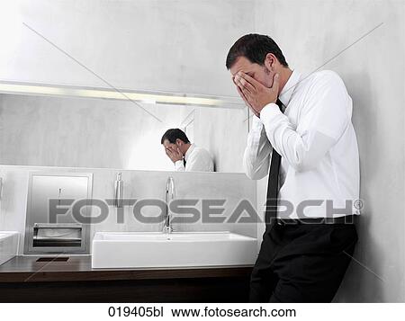 portrait of desperate businessman in public restroom View Large Photo Image Stock Image - portrait of desperate businessman in public restroom. Fotosearch