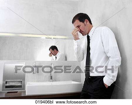 portrait of desperate businessman in public restroom View Large Photo Image Stock Image - portrait of desperate businessman in public restroom. Fotosearch