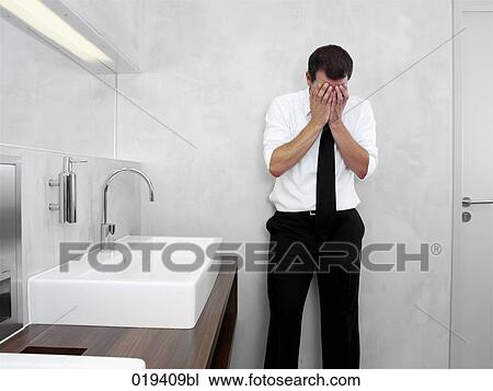 portrait of desperate businessman in public restroom View Large Photo Image Stock Image - portrait of desperate businessman in public restroom. Fotosearch