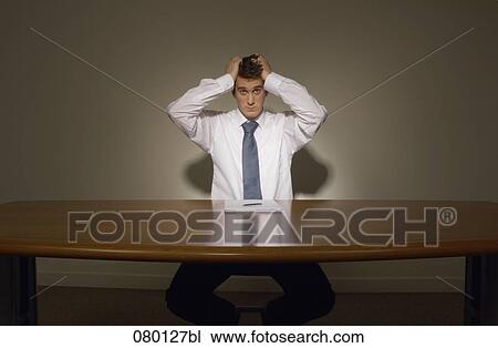 portrait of desperate businessman holding head in hands View Large Photo Image Stock Image - portrait of desperate businessman holding head in hands. Fotosearch
