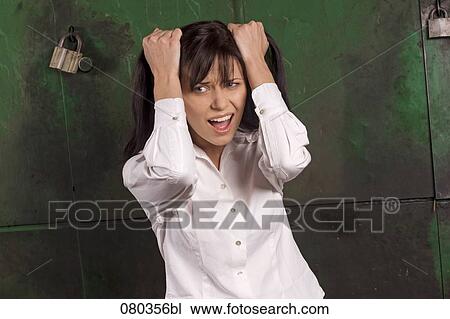 portrait of desperate businesswoman pulling her hair View Large Photo Image Stock Image - portrait of desperate businesswoman pulling her hair. Fotosearch