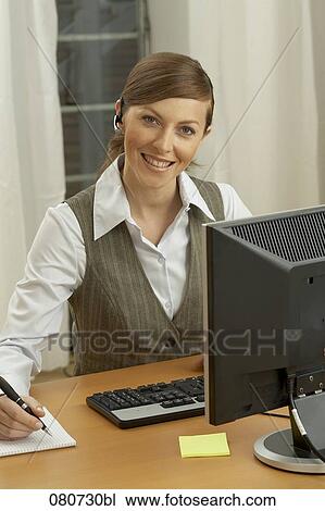 portrait of female call center agent taking notes View Large Photo Image Stock Image - portrait of female call center agent taking notes. Fotosearch