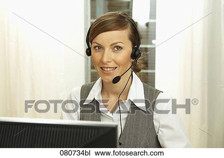Stock Image - portrait of female call center agent. Fotosearch