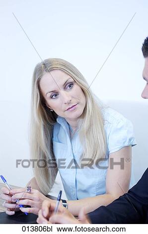 portrait of female executive listening to colleage at conference View Large Photo Image Stock Image - portrait of female executive listening to colleage at conference. Fotosearch