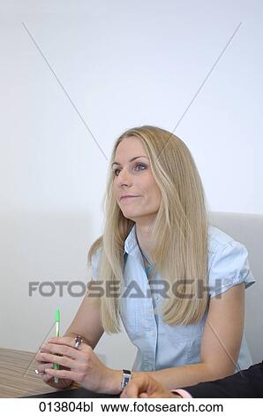 portrait of female executive day-dreaming during meeting View Large Photo Image Stock Image - portrait of female executive day-dreaming during meeting. Fotosearch