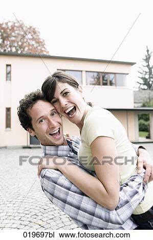 portrait of happy young couple in front of their new home View Large Photo Image Stock Image - portrait of happy young couple in front of their new home. Fotosearch