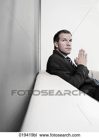portrait of insecure looking businessman View Large Photo Image Stock Image - portrait of insecure looking businessman. Fotosearch