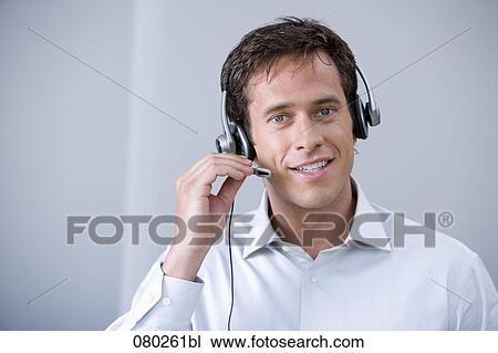 portrait of male call center agent with headset View Large Photo Image Stock Image - portrait of male call center agent with headset. Fotosearch