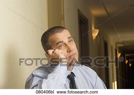 portrait of mature businessman in hotel corridor talking on mobile phone View Large Photo Image Stock Image - portrait of mature businessman in hotel corridor talking on mobile phone. Fotosearch