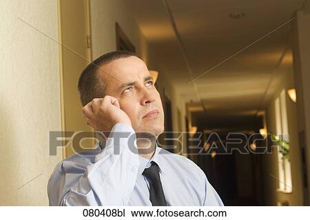 portrait of mature businessman in hotel corridor talking on mobile phone View Large Photo Image Stock Image - portrait of mature businessman in hotel corridor talking on mobile phone. Fotosearch