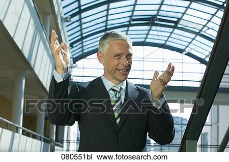 portrait of mature businessman making explanatory gesture View Large Photo Image Stock Image - portrait of mature businessman making explanatory gesture. Fotosearch