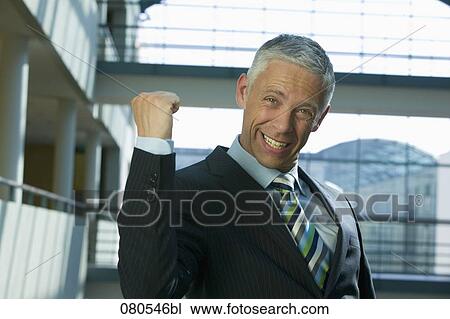 portrait of mature businessman celebrating success View Large Photo Image Stock Image - portrait of mature businessman celebrating success. Fotosearch