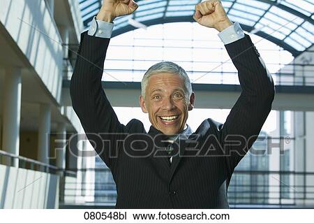 portrait of mature businessman celebrating success View Large Photo Image Stock Image - portrait of mature businessman celebrating success. Fotosearch