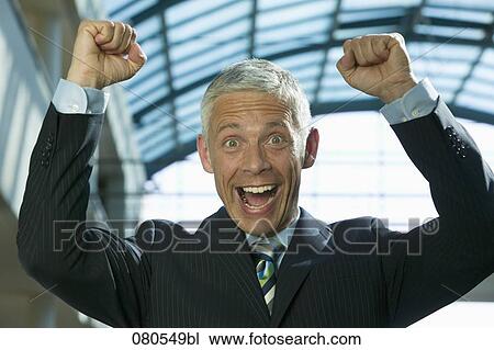 portrait of mature businessman celebrating success View Large Photo Image Stock Image - portrait of mature businessman celebrating success. Fotosearch