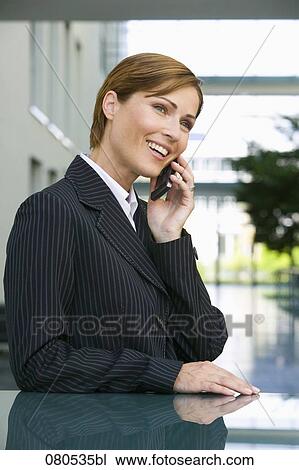 portrait of mature businesswoman talking on mobile phone View Large Photo Image Stock Image - portrait of mature businesswoman talking on mobile phone. Fotosearch