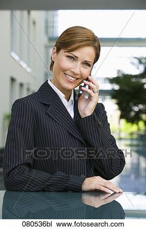 portrait of mature businesswoman talking on mobile phone View Large Photo Image Stock Image - portrait of mature businesswoman talking on mobile phone. Fotosearch