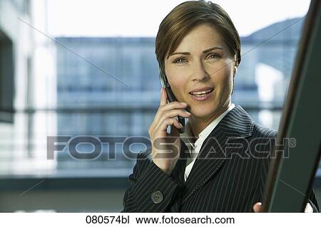 portrait of mature businesswoman listening to mobile phone View Large Photo Image Stock Image - portrait of mature businesswoman listening to mobile phone. Fotosearch