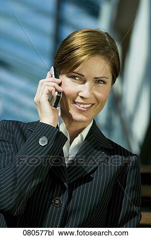 portrait of mature businesswoman listening to mobile phone View Large Photo Image Stock Image - portrait of mature businesswoman listening to mobile phone. Fotosearch