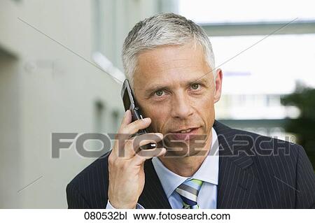 portrait of mature executive talking on mobile phone View Large Photo Image Stock Image - portrait of mature executive talking on mobile phone. Fotosearch
