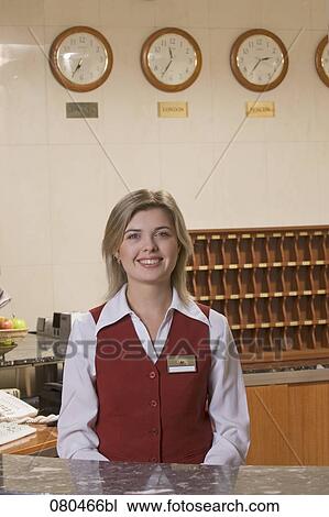 portrait of smiling young receptionist at hotel View Large Photo Image Stock Image - portrait of smiling young receptionist at hotel. Fotosearch