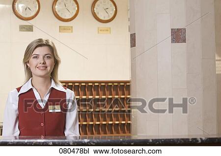 portrait of smiling young receptionist at hotel View Large Photo Image Stock Image - portrait of smiling young receptionist at hotel. Fotosearch