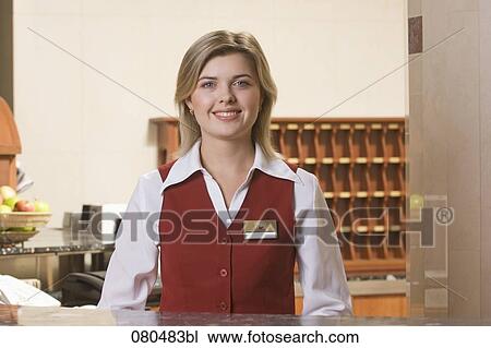 portrait of smiling young receptionist at hotel View Large Photo Image Stock Image - portrait of smiling young receptionist at hotel. Fotosearch