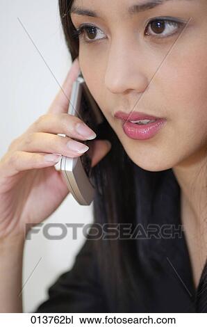 portrait of young asian woman using cellphone View Large Photo Image Stock Image - portrait of young asian woman using cellphone. Fotosearch