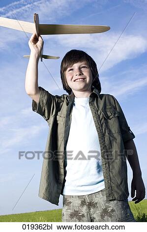 portrait of young boy with toy airplane View Large Photo Image Stock Image - portrait of young boy with toy airplane. Fotosearch