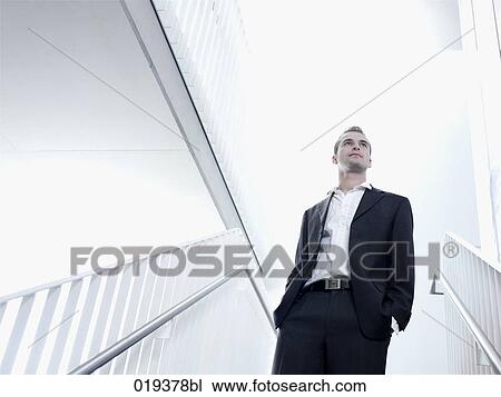 portrait of young businessman standing in staircase View Large Photo Image Stock Image - portrait of young businessman standing in staircase. Fotosearch