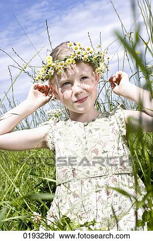 portrait of young girl wearing wreath of daisies View Large Photo Image Stock Image - portrait of young girl wearing wreath of daisies. Fotosearch