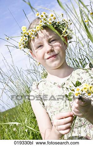 portrait of young girl wearing wreath of daisies View Large Photo Image Stock Image - portrait of young girl wearing wreath of daisies. Fotosearch