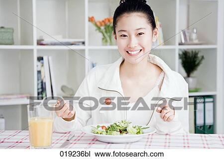 portrait of young japanese girl eating salad View Large Photo Image Stock Image - portrait of young japanese girl eating salad. Fotosearch