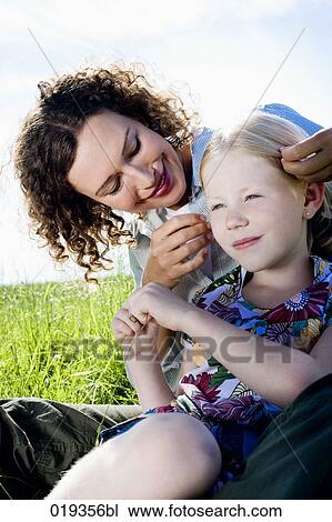 portrait of young mother playing with her daughter View Large Photo Image Stock Image - portrait of young mother playing with her daughter. Fotosearch