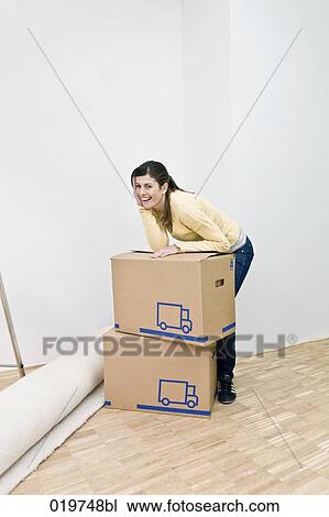 portrait of young woman in her new home View Large Photo Image Stock Image - portrait of young woman in her new home. Fotosearch