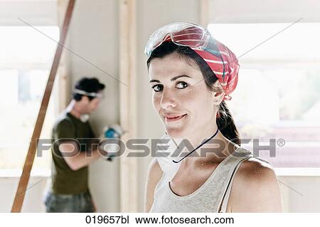portrait of young woman on construction site of new home View Large Photo Image Stock Image - portrait of young woman on construction site of new home. Fotosearch