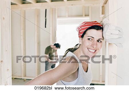 portrait of young woman on construction site View Large Photo Image Stock Image - portrait of young woman on construction site. Fotosearch