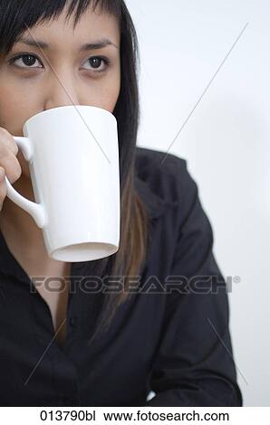 portrait young asian woman drinking from white cup View Large Photo Image Stock Image - portrait young asian woman drinking from white cup. Fotosearch