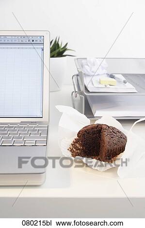 still life of chocolate muffin on office desk View Large Photo Image Stock Image - still life of chocolate muffin on office desk. Fotosearch