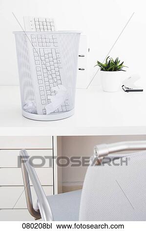 still life of computer keyboard in wastebasket on office desk View Large Photo Image Stock Image - still life of computer keyboard in wastebasket on office desk. Fotosearch
