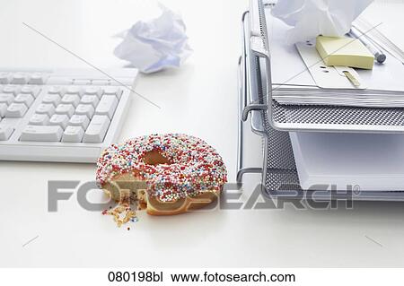 still life of donut on office desk View Large Photo Image Stock Image - still life of donut on office desk. Fotosearch