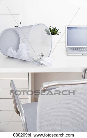 still life of empty alcohol bottle in wastebasket on office desk View Large Photo Image Stock Image - still life of empty alcohol bottle in wastebasket on office desk. Fotosearch
