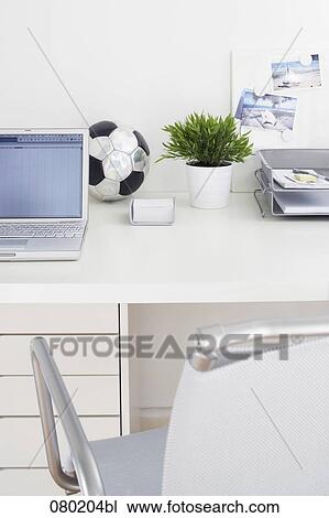 still life of football on empty office desk View Large Photo Image Stock Image - still life of football on empty office desk. Fotosearch