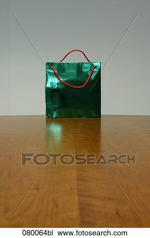 still life of green shopping bag on table View Large Photo Image Stock Image - still life of green shopping bag on table. Fotosearch