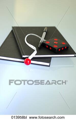 Stock Image - still life of notebooks, pen and tape measure. Fotosearch