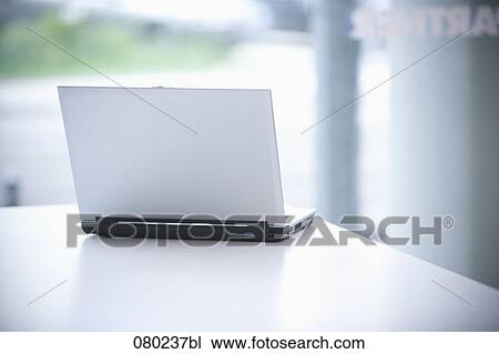 still life of open laptop on desk View Large Photo Image Stock Image - still life of open laptop on desk. Fotosearch