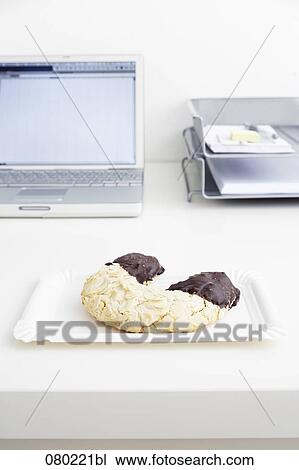 still life of pastry on paper plate on office desk View Large Photo Image Stock Image - still life of pastry on paper plate on office desk. Fotosearch
